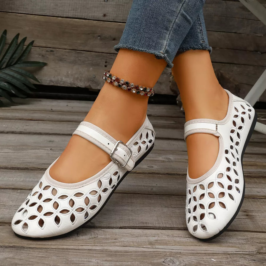 flats in black with floral and round toe