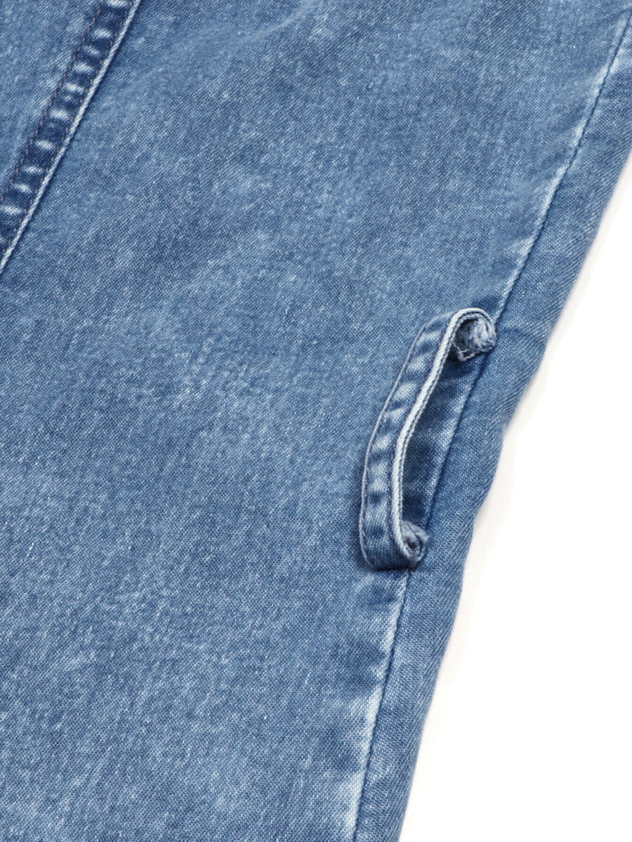Button-front halter neck denim dress in blue with a rolled detail.