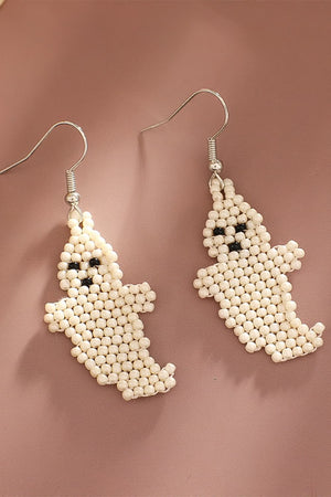 Beaded ghost fringe earrings in ivory with black bead eyes and mouth.