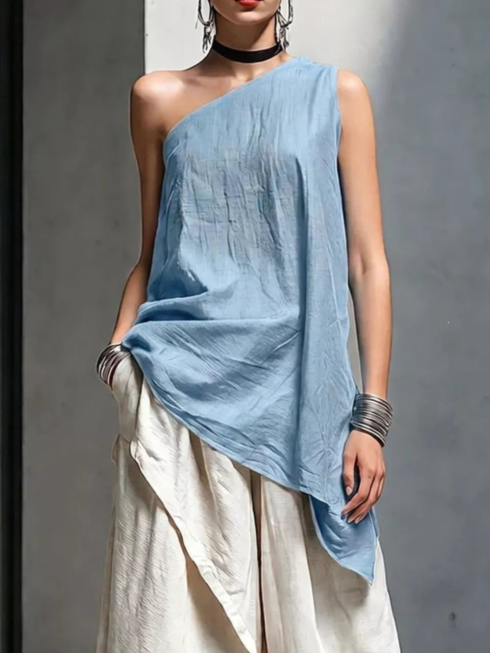 one-shoulder top in sky blue featuring pocketed and relaxed fit