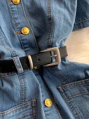 Light blue denim dress with belt detail, gold buttons and chest pockets.