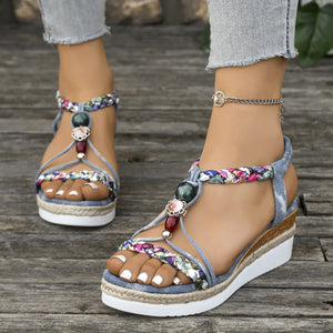 Bohemian beaded espadrille wedges in dusty blue with floral print straps and colorful beads.