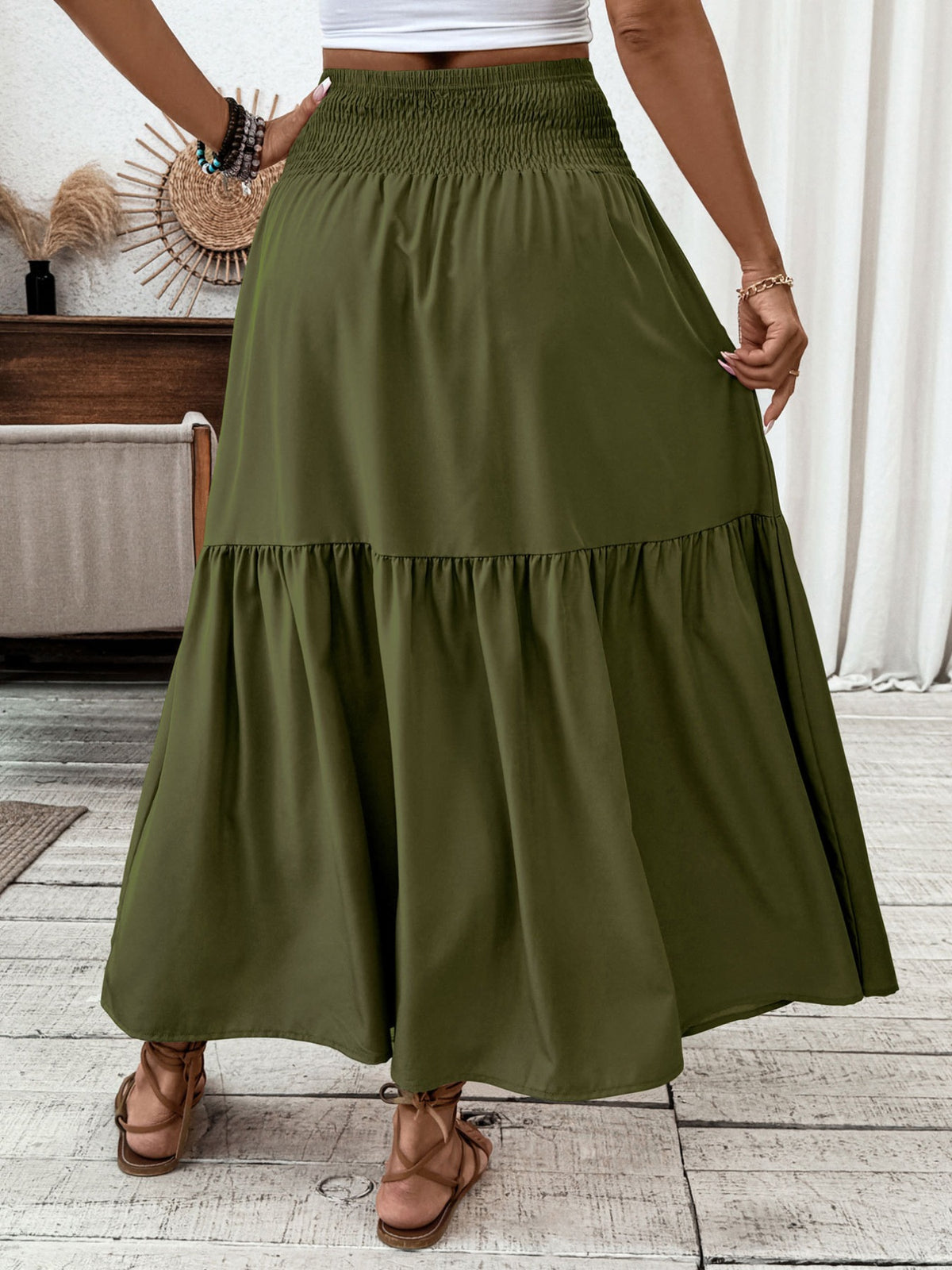Army green ruffled smocked waist maxi skirt with tiered hem detail.