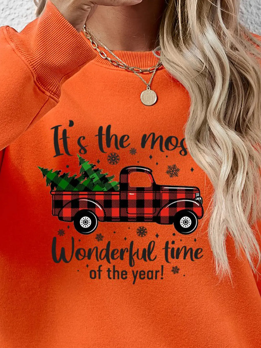 Orange sweatshirt with buffalo plaid truck graphic and holiday text