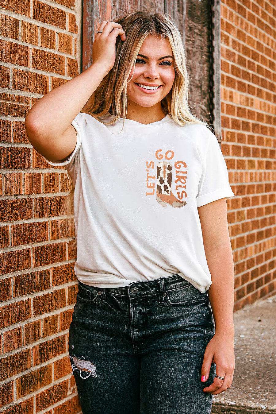 White graphic tee with "Let's Go Girls" and cowboy boot design