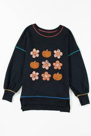 Black sweatshirt with floral and pumpkin embroidery and contrast stitching.
