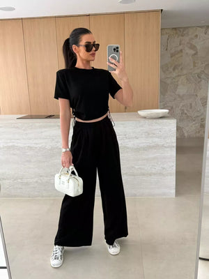 Black crop top with drawstring sides and wide-leg pants set