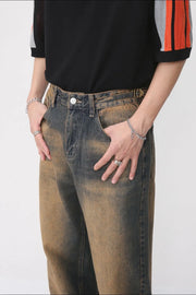 Faded wash wide leg jeans in dark denim with a distressed look.