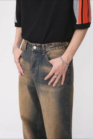 Faded wash wide leg jeans in dark denim with a distressed look.