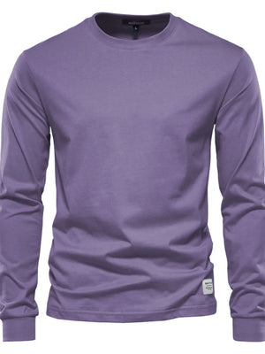 Essential crewneck long sleeve t-shirt in mauve with a small white tag detail on the hem.