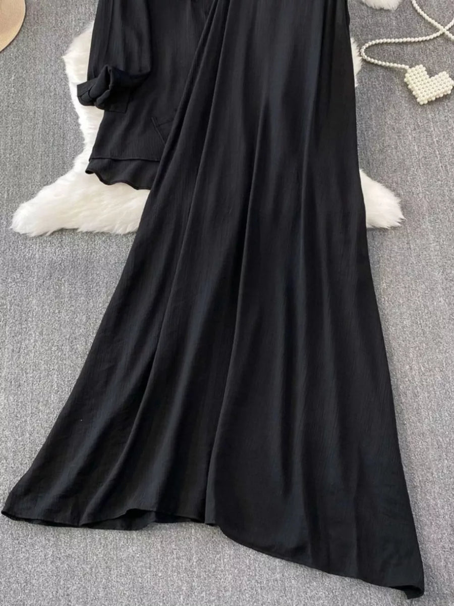 Black embroidered floral two-piece set with collared top and flowing skirt