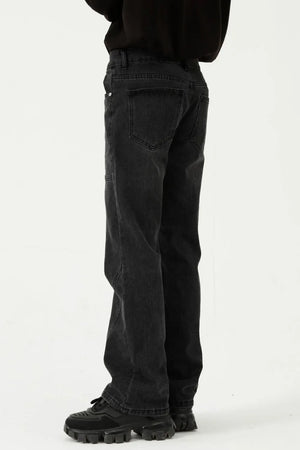 Black denim straight leg jeans with panel seams and a relaxed fit.