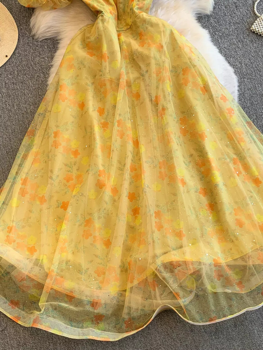 Yellow floral maxi dress with sweetheart neckline and lace embellishments.