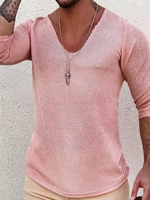 Textured slouchy v-neck knit top in Dusty Pink with a relaxed fit and raw hem detail.