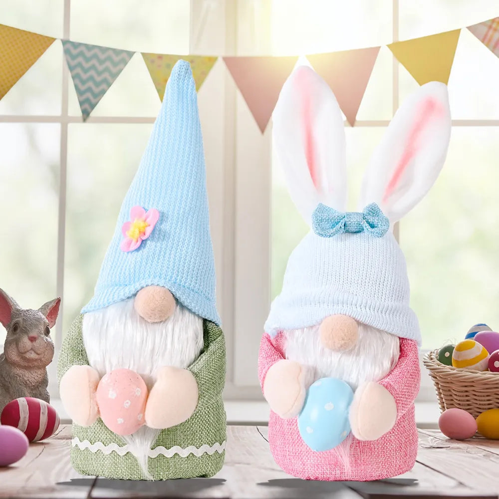 Pink and sage knit gnomes with bunny ears and Easter eggs, cute seasonal decor.