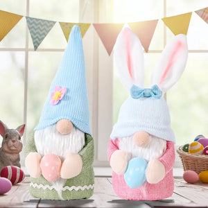 Pink and sage knit gnomes with bunny ears and Easter eggs, cute seasonal decor.