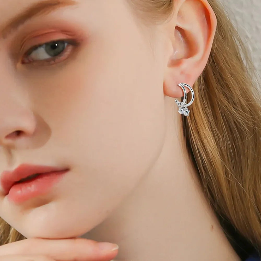 Silver cubic drop hoop earrings with cubic charms.