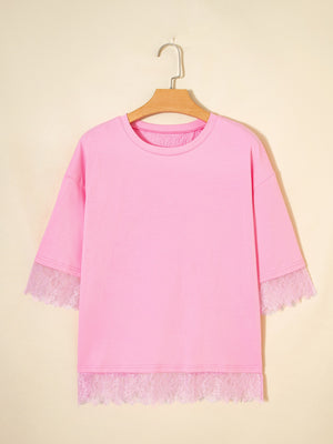 Pink cotton blend oversized tee with floral lace trim on sleeves and hem.