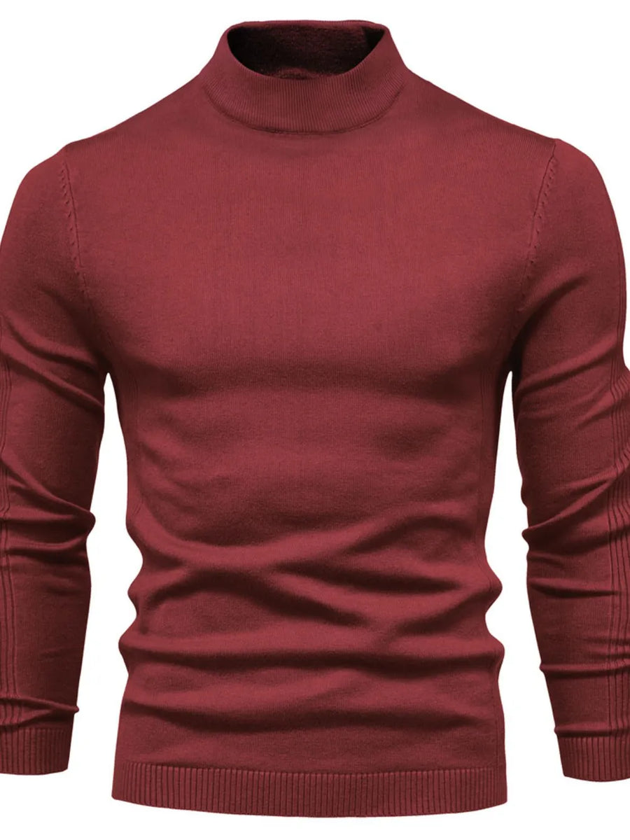 Ribbed mock neck sweater in plum purple with sculpted shoulder detail and long sleeves.