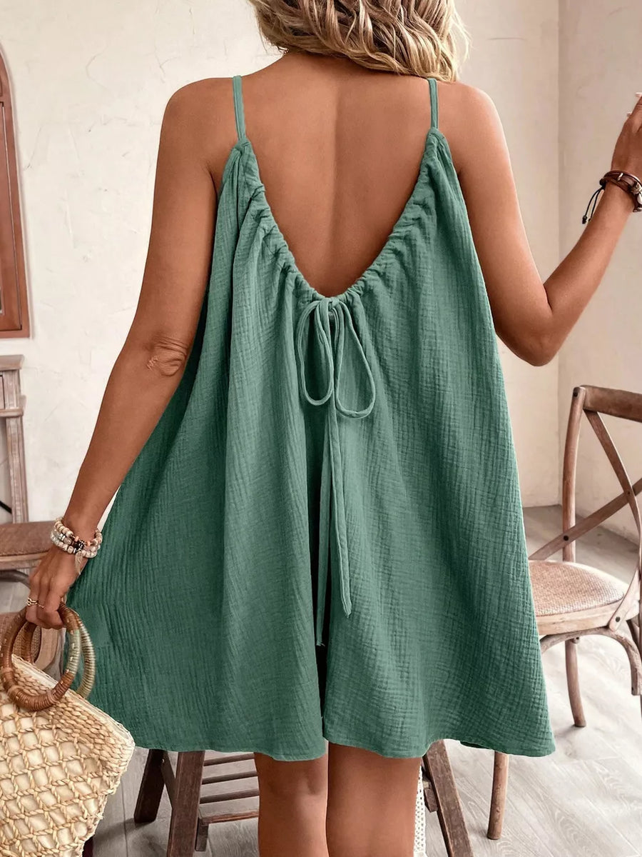 Mint green cotton gauze spaghetti strap dress with tie back detail