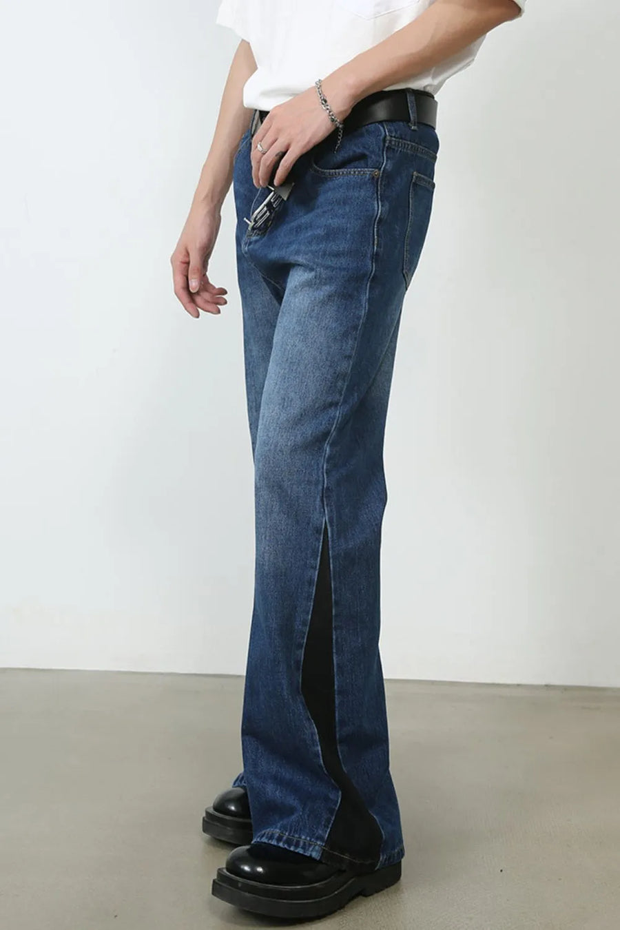 Contrast panel bootcut denim trousers in medium blue with a side slit detail.
