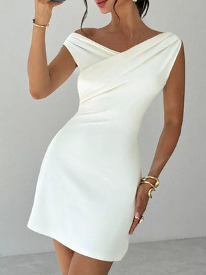 White off-shoulder sweetheart mini dress with draped detail and cap sleeves.