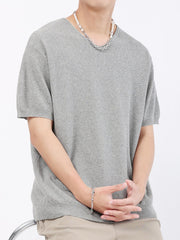 Men's gray short-sleeve knit t-shirt with V-neck and textured fabric.