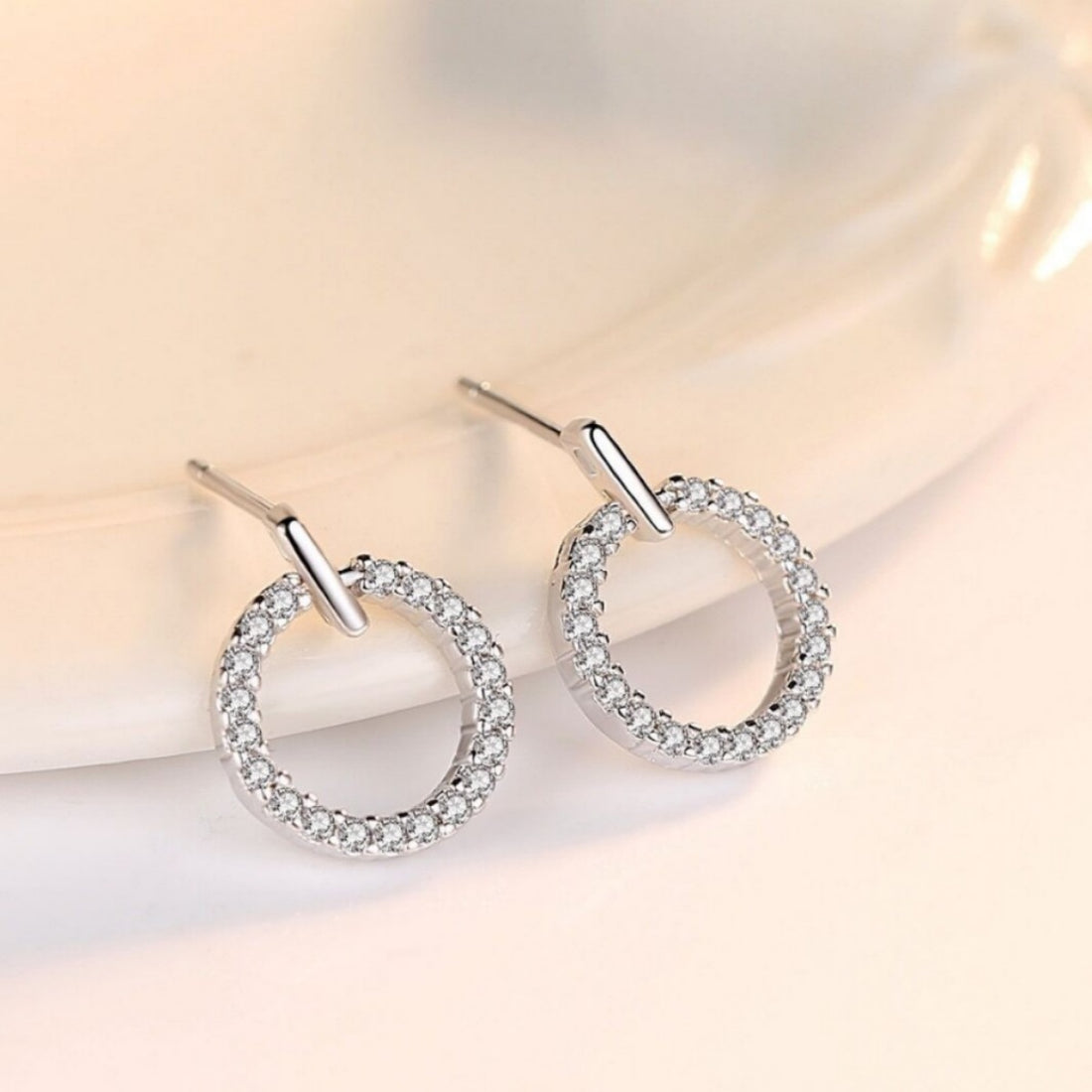 earrings in silver featuring rhinestone embellishment and straight fit