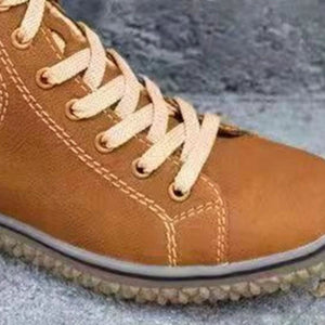 Ankle boots in olive green with lace-up closure and ankle-length