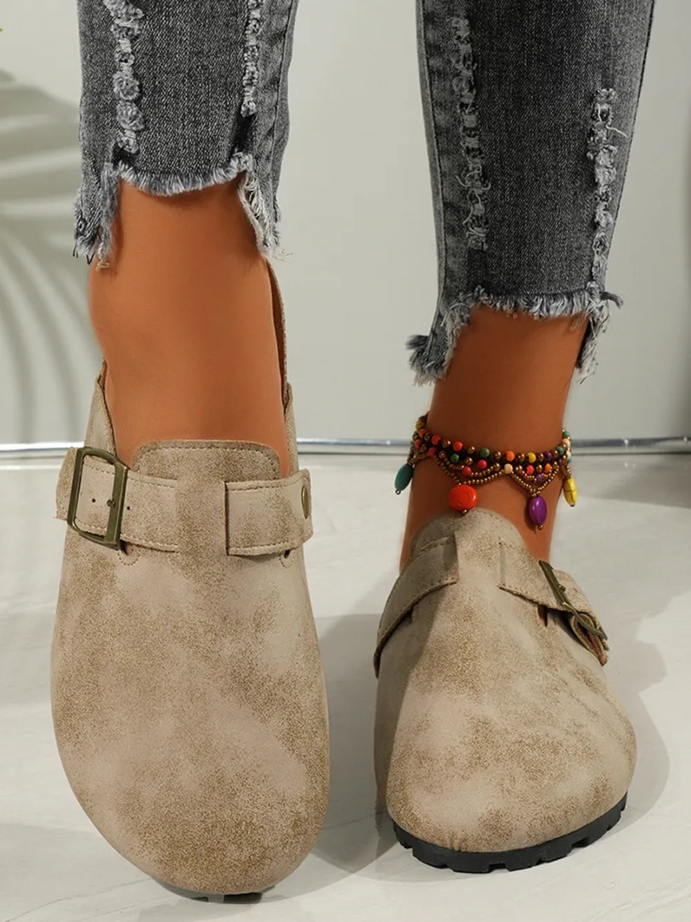 Textured suede buckle detail cork mules in beige with adjustable strap.