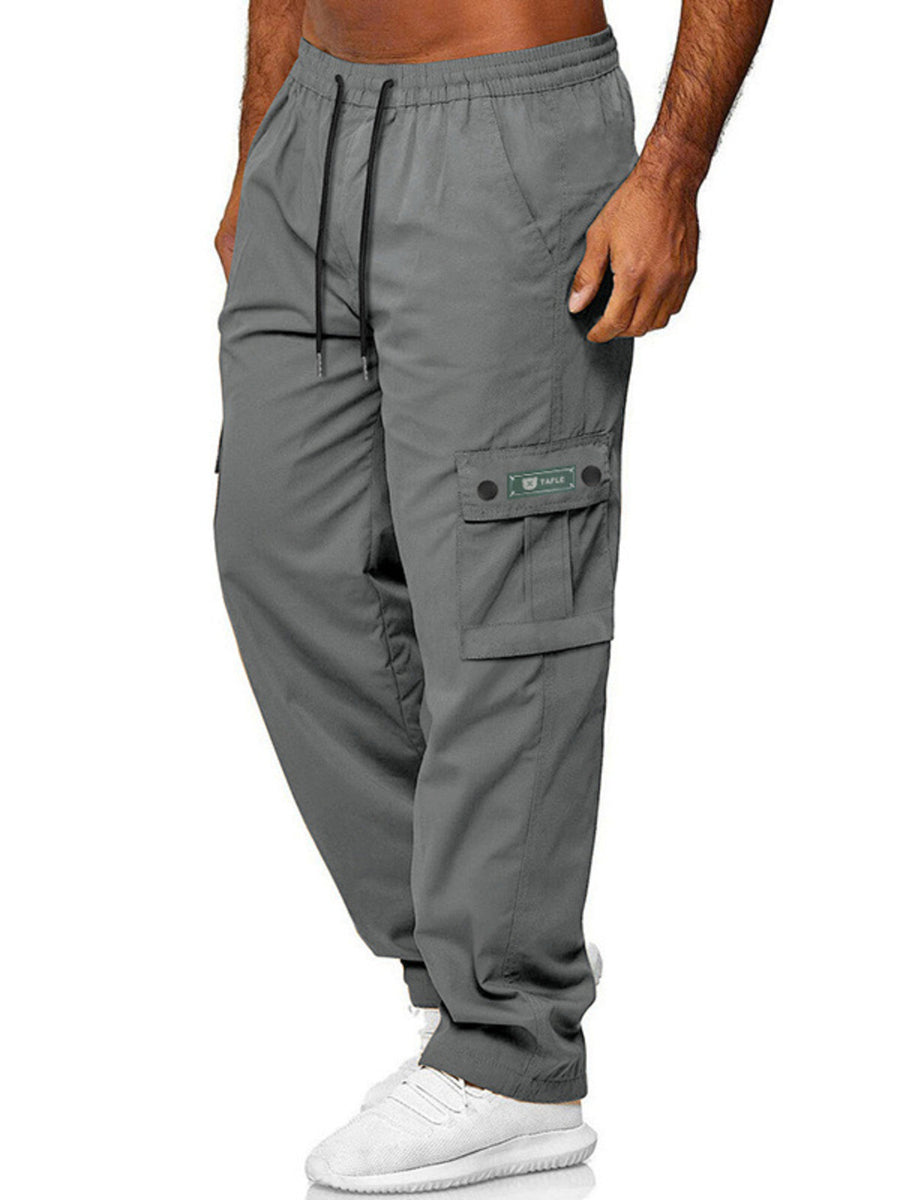 Gray cargo pants with adjustable waist, drawstring, and side pocket detail.
