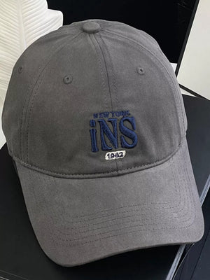 Grey baseball cap with embroidered New York INS 1982 detail