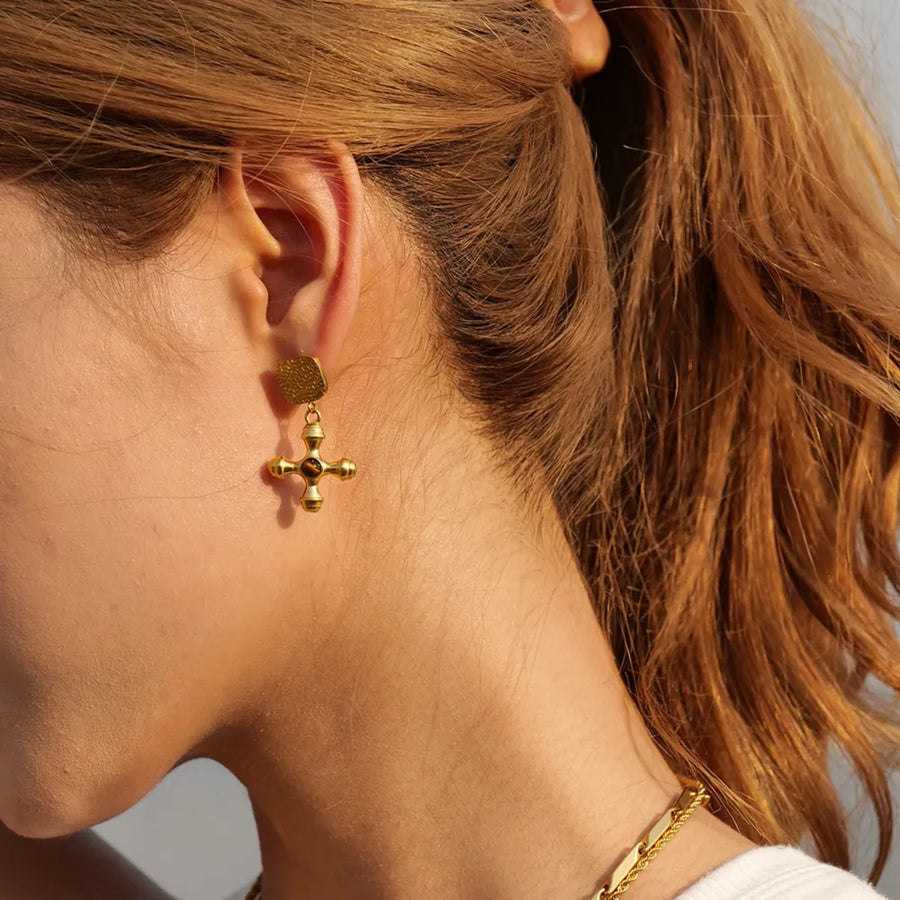 Textured cross drop earrings in 18K gold-plated metal with a square top.