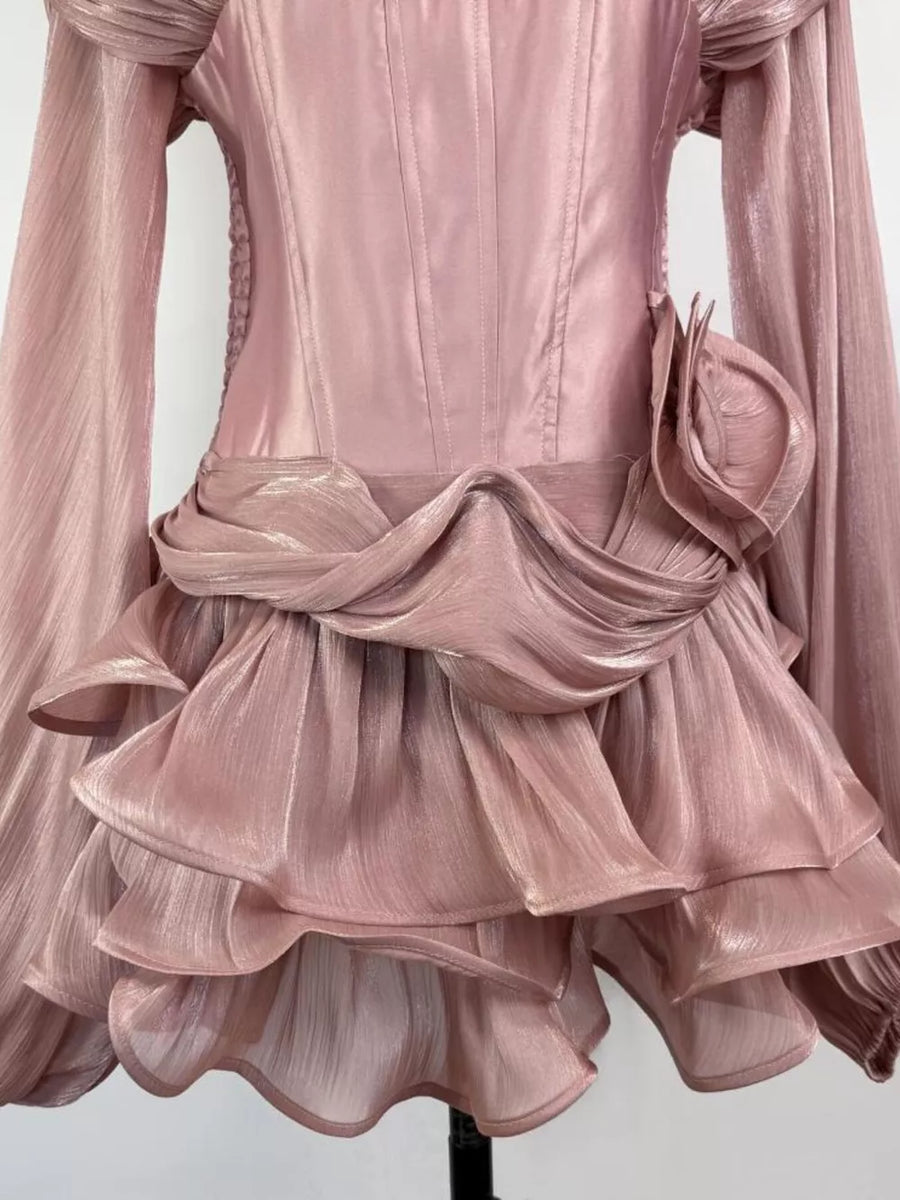 Pink ruffled mini dress with corset waist and draped detail