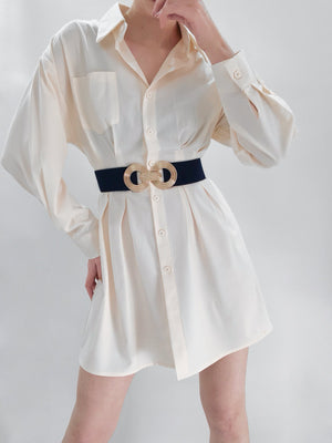 Black stretch belt with interlocking gold buckle detail