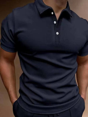 Navy short sleeve polo shirt with button placket and collar.
