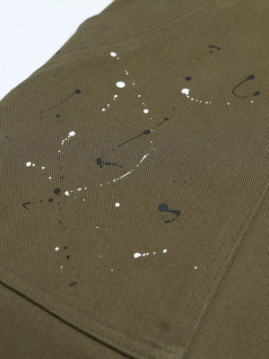 Olive cotton cargo pants with black and white paint splatter design