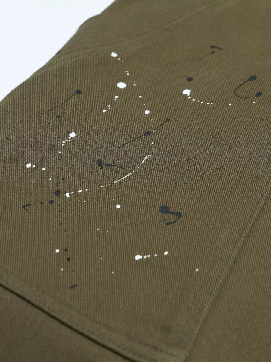 Olive cotton cargo pants with black and white paint splatter design