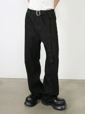Black denim wide-leg trousers with a matching belt and silver buckle.