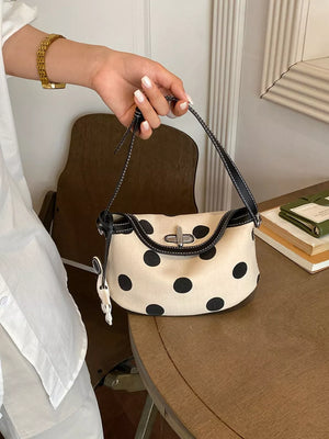 shoulder bag in cream featuring flap closure and structured fit