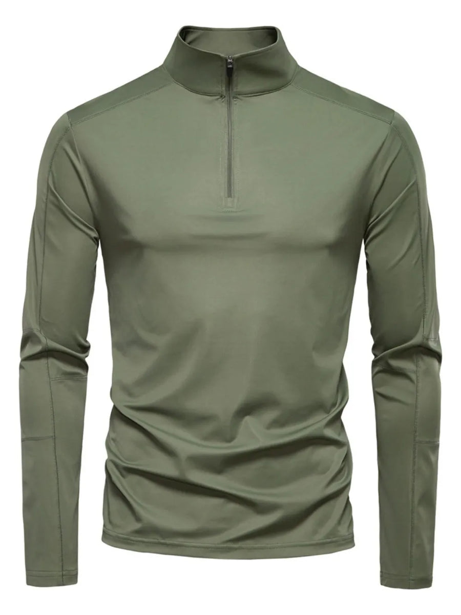 Moss green performance zip-neck tee with structured shoulders and long sleeves.