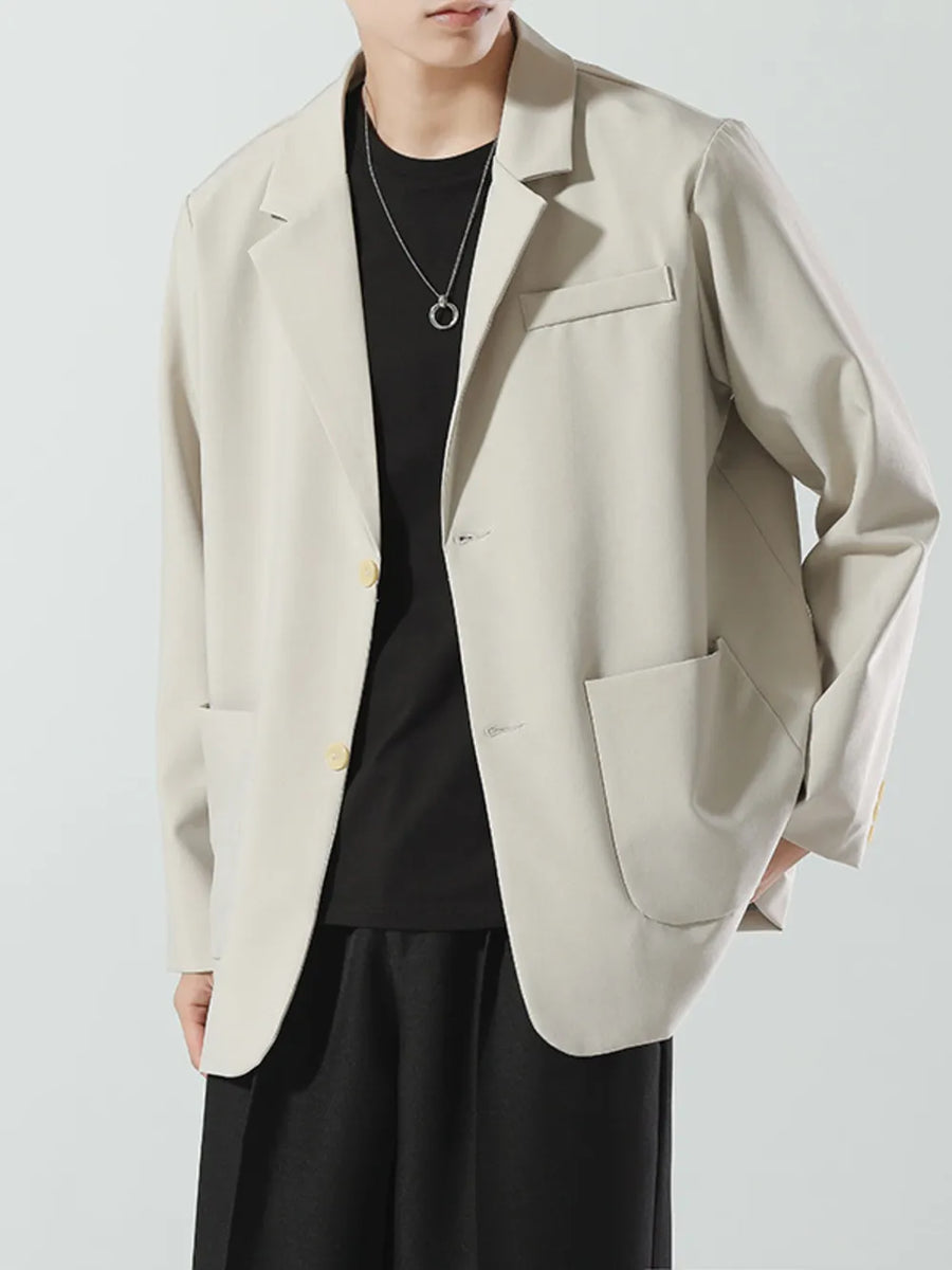 Men's beige relaxed fit blazer with two buttons and patch pockets.