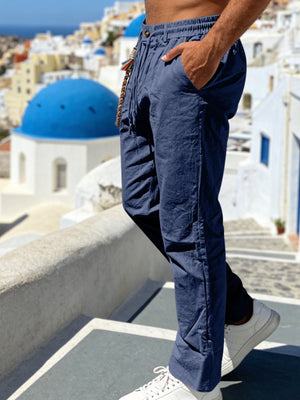 Men's navy linen blend drawstring pants with pockets and a beaded tie.