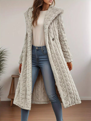 Hooded longline button up coat in off-white with textured knit pattern and button closure.