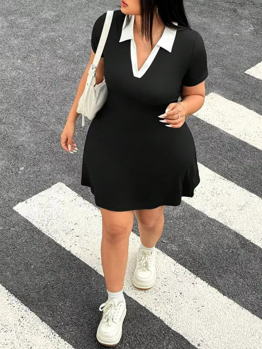 Black plus-size bodycon mini dress with white contrast collar and short sleeves.