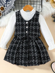 Toddler black and white plaid vest and long sleeve top set with decorative buttons.