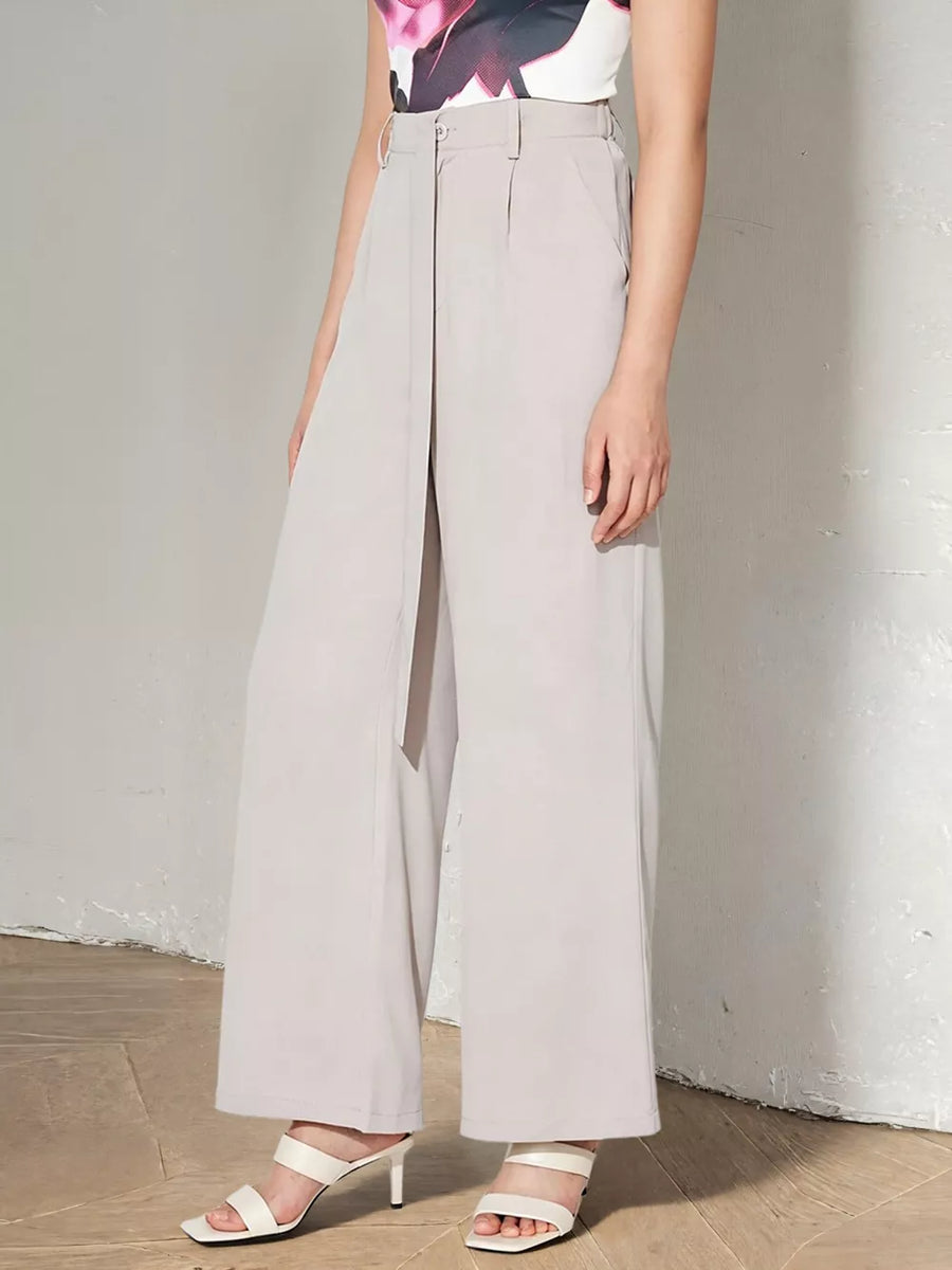 Light gray maternity pants with a high waist, wide legs, and self-tie detail.