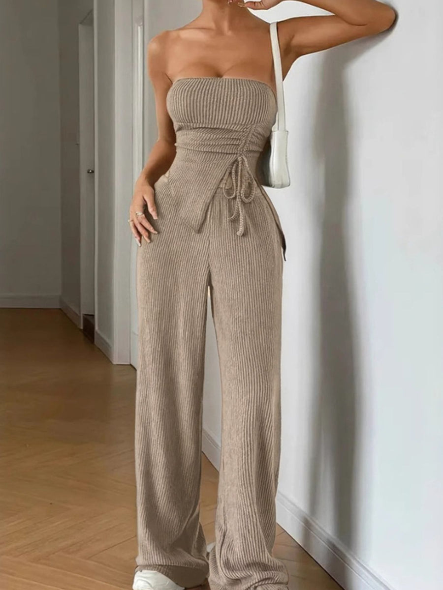 Ribbed knit tube top with drawstring detail and wide leg pants in beige.