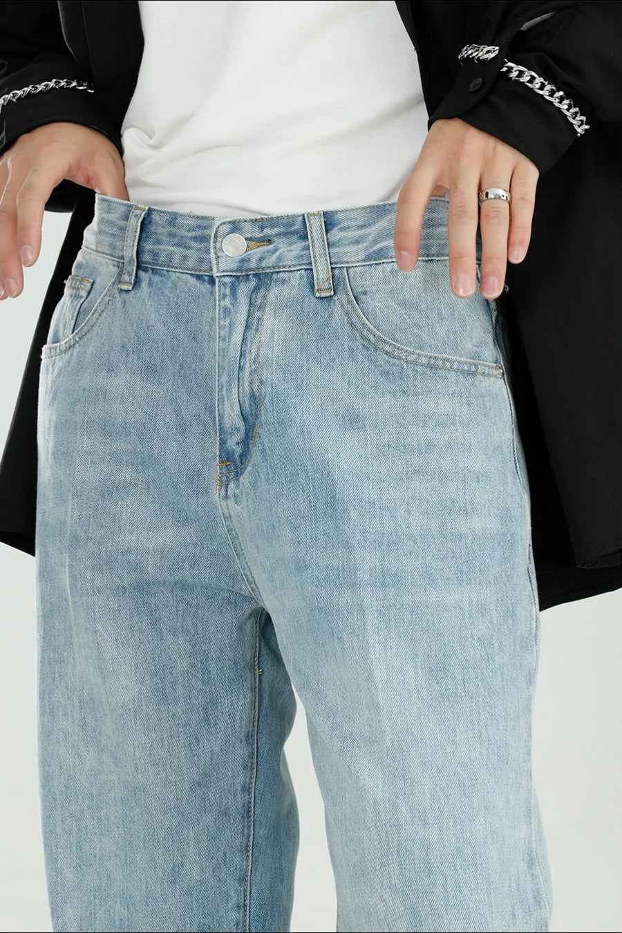 Relaxed fit light wash denim jeans with a modern wide leg cut.
