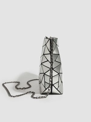 black crossbody bag featuring chain strap and geometric